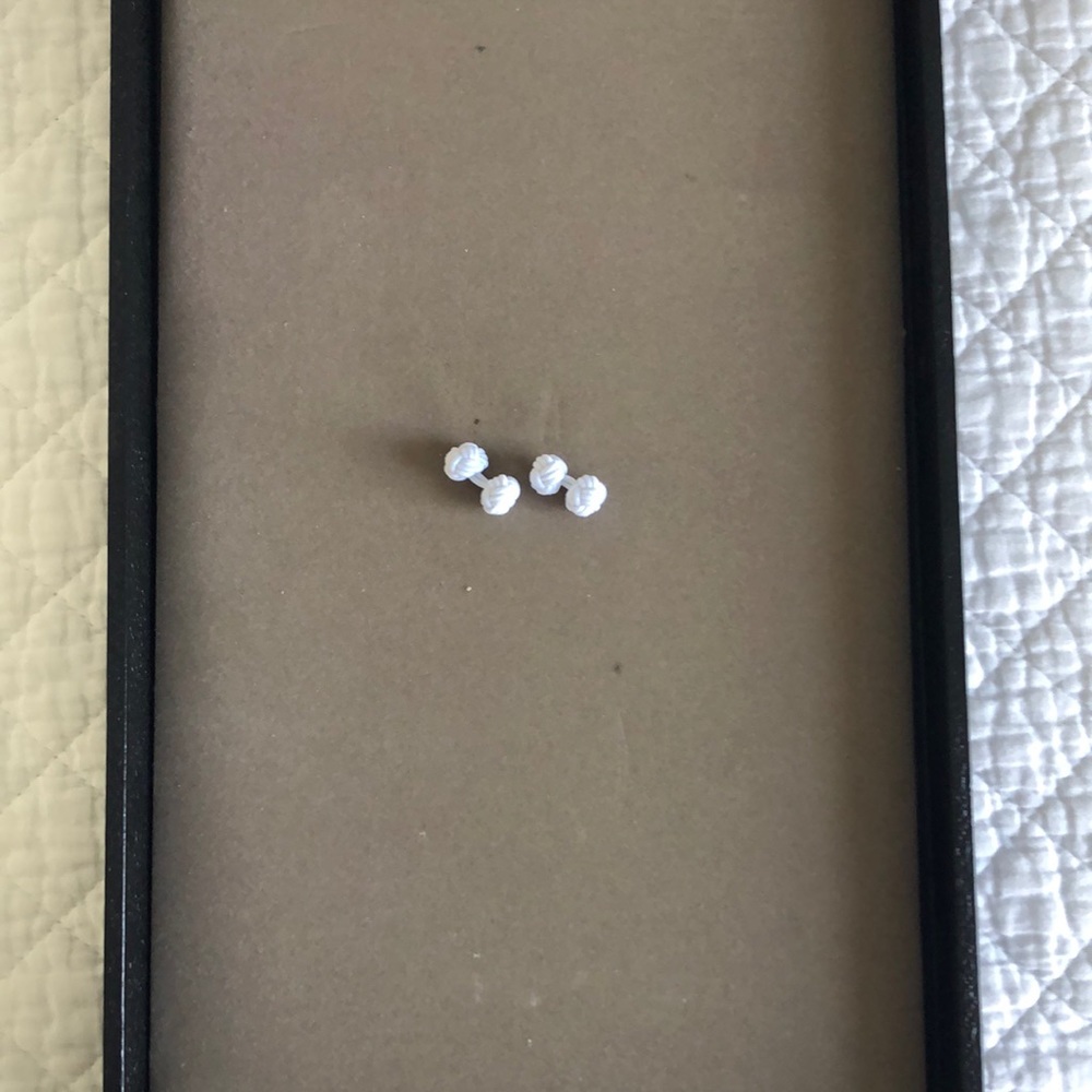 Pair of white silk cuff links